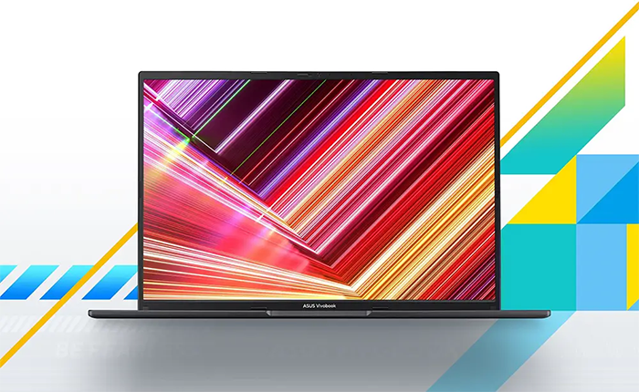 Vista frontal del ASUS Vivobook 16 abierto, destacando su amplia pantalla de 16 pulgadas con bordes delgados (NanoEdge) y una relaci&oacute;n de aspecto 16:10. En la pantalla se aprecia un fondo de pantalla colorido y abstracto.