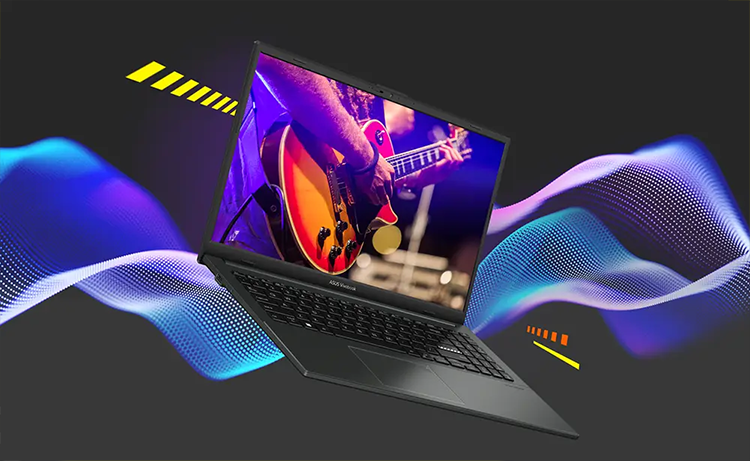 Vista del dispositivo ASUS Vivobook Go 15 abierto destacando sus parlantes y capacidad de audio