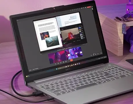 El notebook en un entorno de escritorio gamer, rodeado de accesorios, demostrando c&oacute;mo se integra perfectamente en un ecosistema de juego profesional.