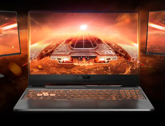 Vista frontal del notebook ASUS TUF Gaming A15 abierto. Muestra una pantalla de 15.6 pulgadas con bordes delgados y un teclado retroiluminado con las teclas WASD resaltadas en color blanco transparente para jugadores.